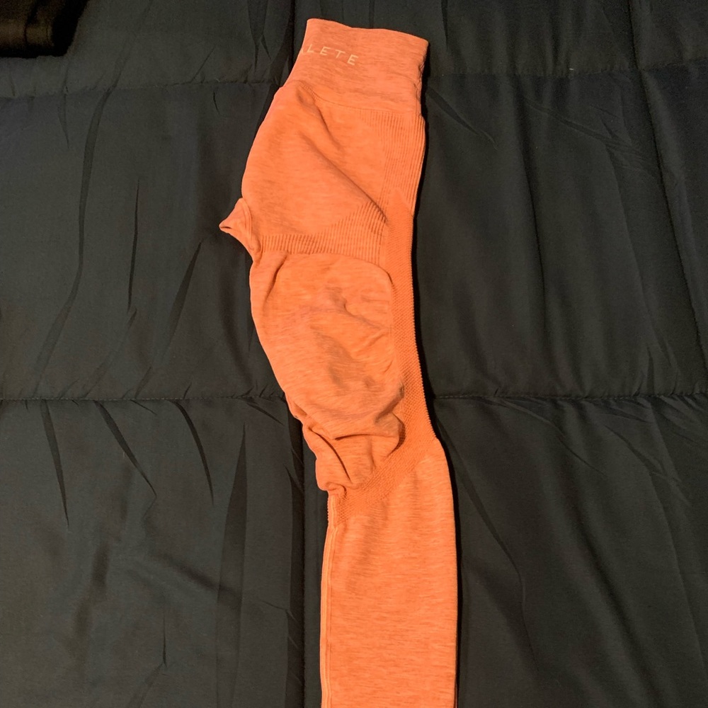 Alphalete legs in light pink/salmon color. Like new, no tears, stains, or rips.